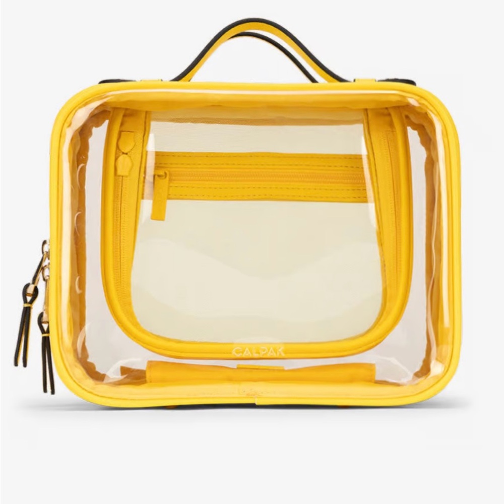 CalPak make up bag in yellow. Holds a ton of toiletries and is very organized.